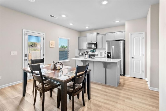 dining room featuring light wood-type flooring