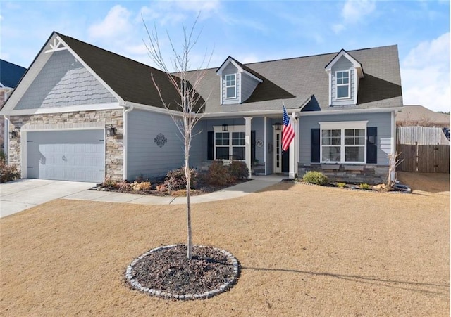 cape cod home with a garage and a porch