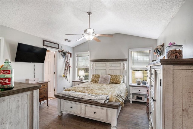 bedroom with multiple windows, dark hardwood / wood-style flooring, vaulted ceiling, and ceiling fan