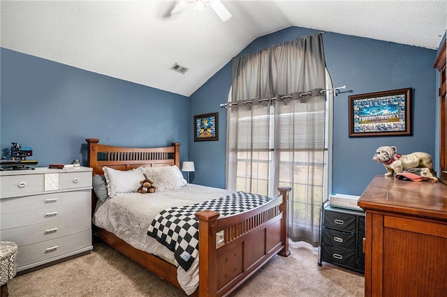 bedroom with lofted ceiling, ceiling fan, and light colored carpet