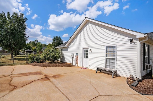 view of property exterior featuring a patio area