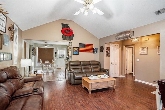 living room featuring lofted ceiling, ceiling fan, and dark hardwood / wood-style floors