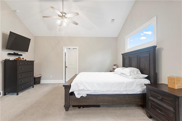 carpeted bedroom featuring vaulted ceiling and ceiling fan