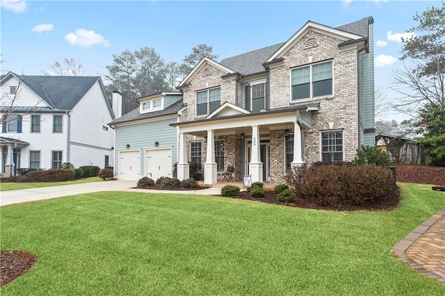 view of front of property featuring a front lawn, covered porch, and a garage