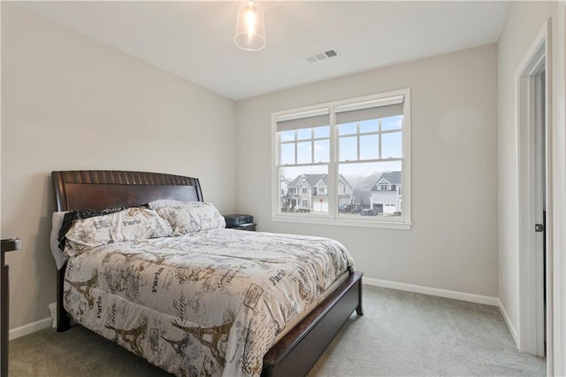 bedroom featuring light colored carpet