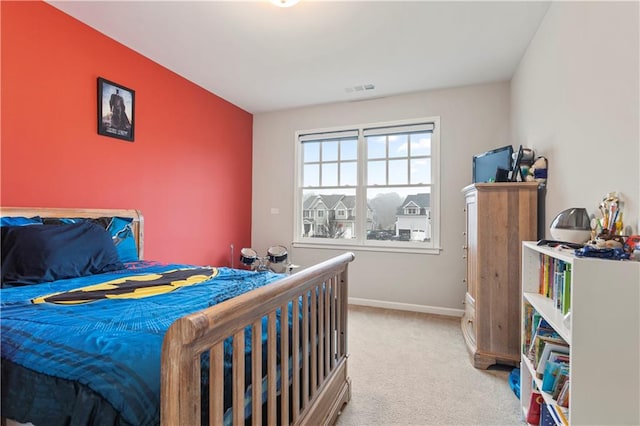 bedroom with light carpet