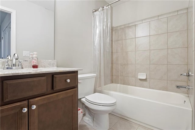 full bathroom with tile floors, toilet, vanity, and shower / tub combo