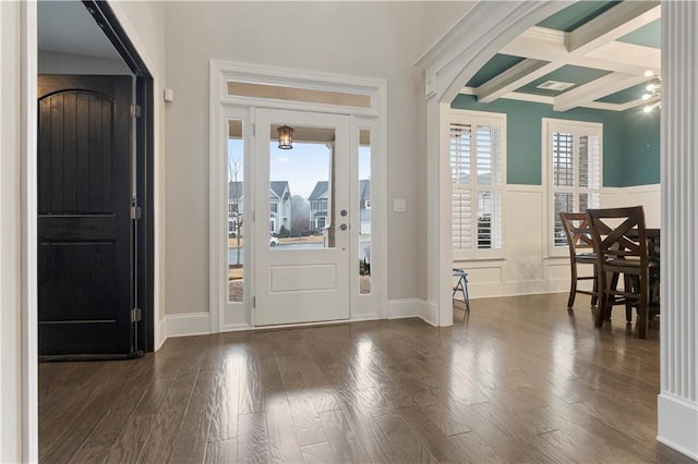 foyer entrance with coffered ceiling, dark hardwood / wood-style floors, and beamed ceiling