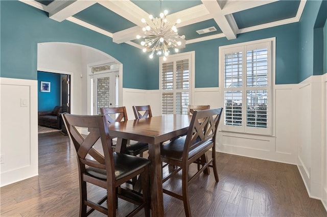 dining room with coffered ceiling, a notable chandelier, beam ceiling, dark wood-type flooring, and crown molding