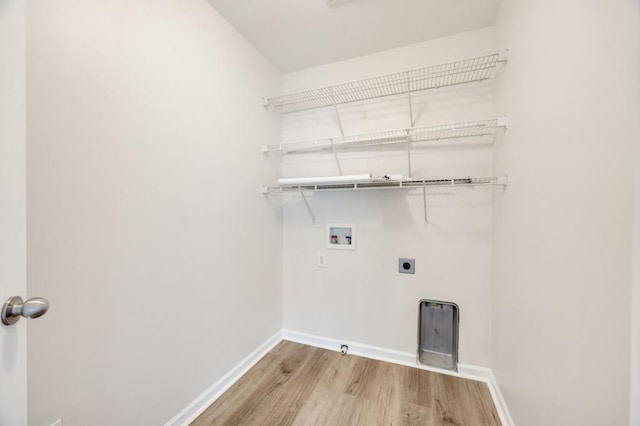 clothes washing area with washer hookup, hardwood / wood-style floors, and electric dryer hookup