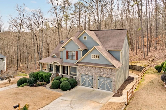 craftsman house featuring a garage and a porch