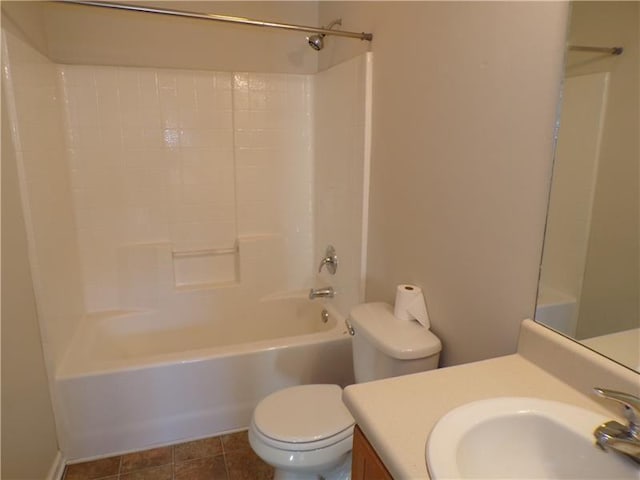 bathroom with tile patterned flooring, shower / bath combination, vanity, and toilet