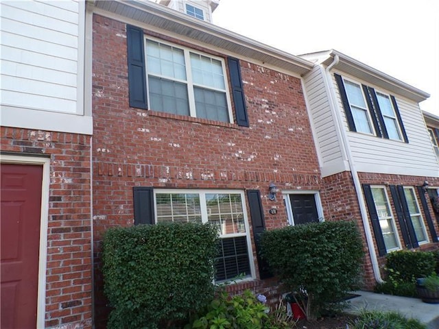 view of front of home with brick siding