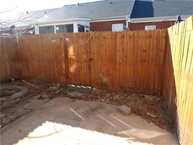 view of yard featuring a patio area and fence