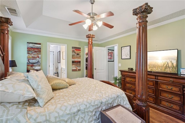 64 River Mist Cir, Jefferson, GA 30549 - bedroom featuring ornate columns, crown molding, wood finished floors, a raised ceiling, and a ceiling fan