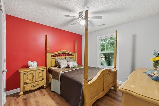 64 River Mist Cir, Jefferson, GA 30549 - bedroom featuring wood finished floors, a textured ceiling, and a ceiling fan