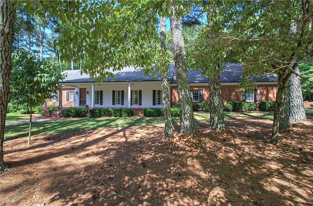 single story home featuring covered porch