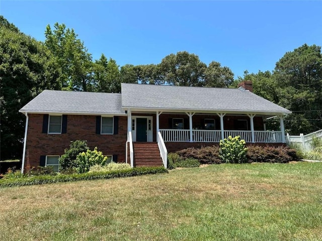 view of front facade with covered porch and a front yard