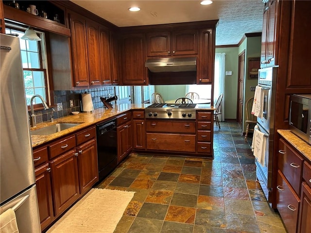 kitchen featuring tasteful backsplash, stainless steel appliances, dark tile patterned floors, ornamental molding, and sink