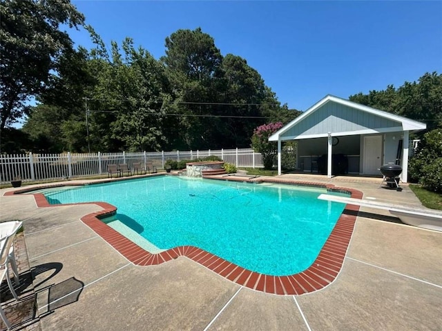 view of pool featuring a diving board and a patio area