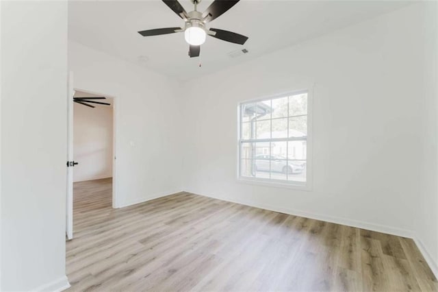 empty room featuring ceiling fan and light wood-type flooring