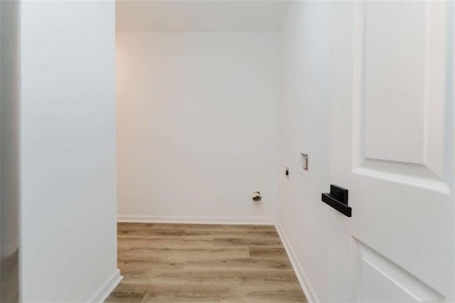 washroom featuring washer hookup and light hardwood / wood-style floors