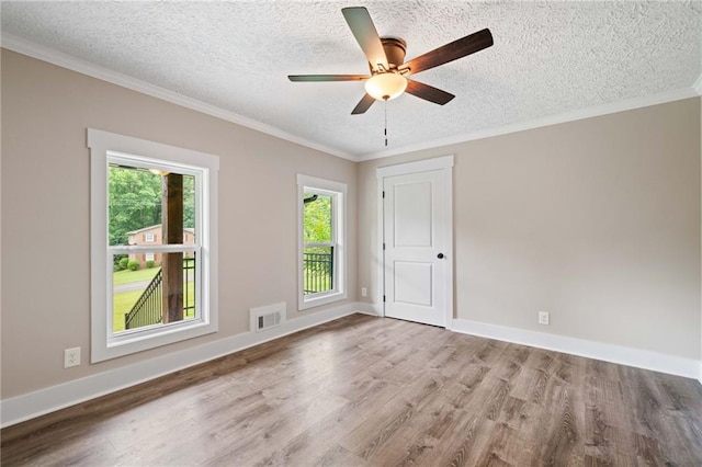 136 Ridgecrest Dr, Ball Ground, GA 30107 - empty room featuring wood finished floors, a textured ceiling, ceiling fan, ornamental molding, and baseboards