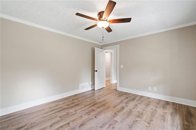 136 Ridgecrest Dr, Ball Ground, GA 30107 - unfurnished room featuring light wood-type flooring, a textured ceiling, a ceiling fan, baseboards, and crown molding