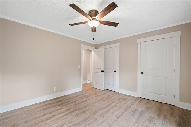 136 Ridgecrest Dr, Ball Ground, GA 30107 - unfurnished bedroom featuring light wood finished floors, ornamental molding, baseboards, a textured ceiling, and ceiling fan