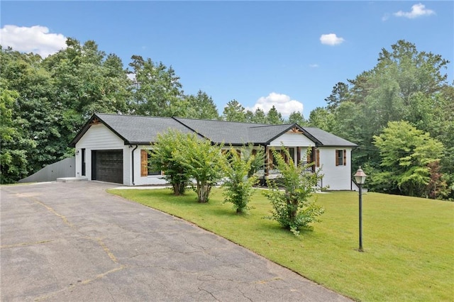 136 Ridgecrest Dr, Ball Ground, GA 30107 - view of front facade with an attached garage, driveway, and a front lawn