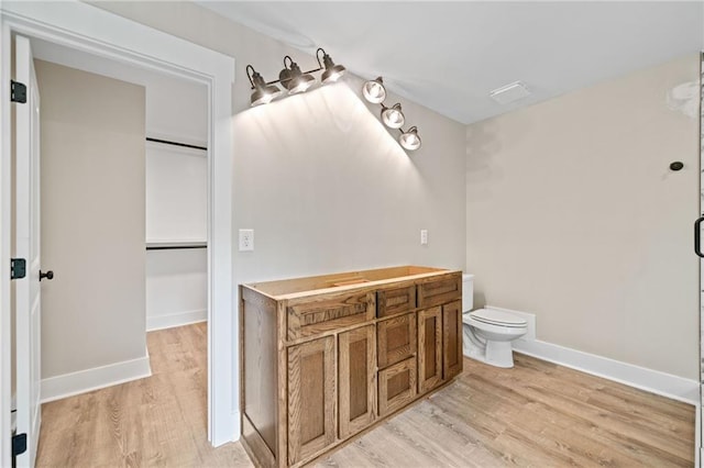 136 Ridgecrest Dr, Ball Ground, GA 30107 - bathroom featuring wood finished floors, toilet, and baseboards