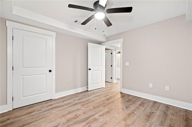 136 Ridgecrest Dr, Ball Ground, GA 30107 - unfurnished bedroom with light wood finished floors, baseboards, and a ceiling fan