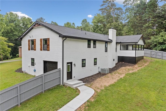136 Ridgecrest Dr, Ball Ground, GA 30107 - rear view of house featuring a garage, a chimney, and brick siding