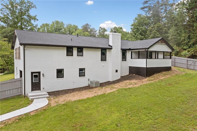 136 Ridgecrest Dr, Ball Ground, GA 30107 - rear view of property with a chimney, brick siding, a sunroom, central AC, and roof with shingles