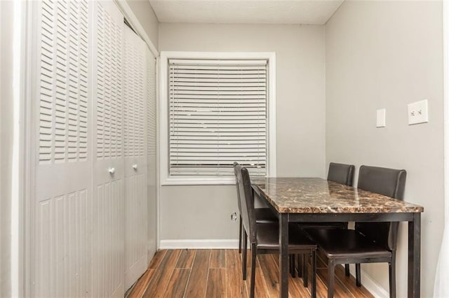 365 Winding River Dr Unit # E, Atlanta, GA 30350 - dining room featuring dark wood-style flooring and baseboards
