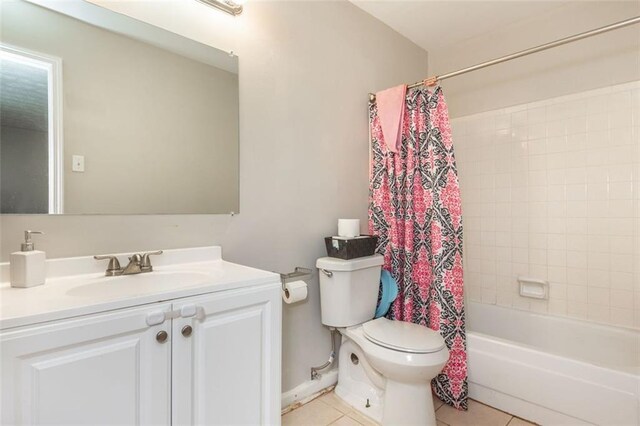 365 Winding River Dr Unit # E, Atlanta, GA 30350 - bathroom featuring toilet, tile patterned flooring, vanity, shower / tub combo, and baseboards