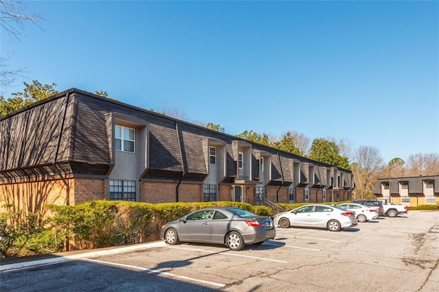 365 Winding River Dr Unit # E, Atlanta, GA 30350 - view of building exterior featuring uncovered parking