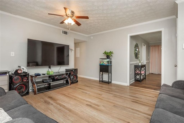 365 Winding River Dr Unit # E, Atlanta, GA 30350 - living room featuring wood finished floors, a ceiling fan, a textured ceiling, baseboards, and ornamental molding