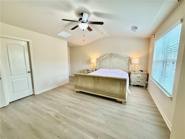 2351 Attewood Dr, Buford, GA 30519 - bedroom with multiple windows, light wood-style flooring, baseboards, and lofted ceiling
