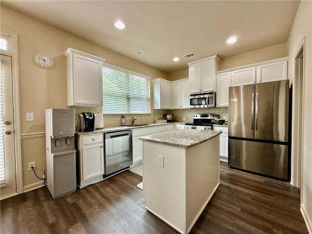 2351 Attewood Dr, Buford, GA 30519 - kitchen featuring appliances with stainless steel finishes, a sink, white cabinetry, dark wood-style flooring, and recessed lighting