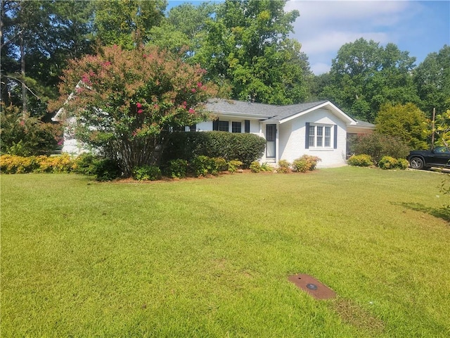 view of front of home featuring a front lawn