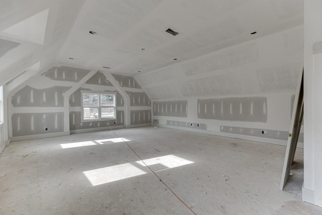 bonus room with vaulted ceiling