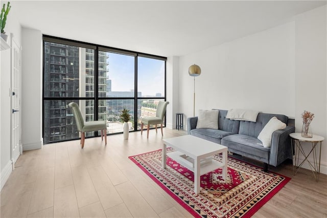 1280 W Peachtree St NW Unit 2409, Atlanta, GA 30309 - living area with expansive windows and wood finished floors