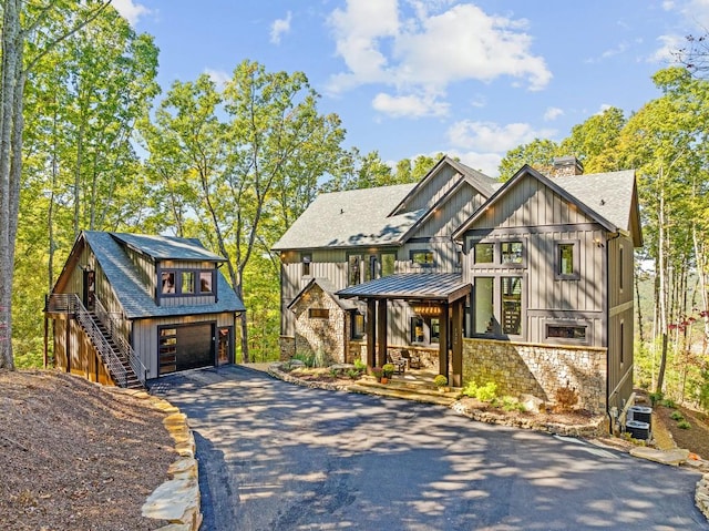 view of front of property featuring a garage and covered porch