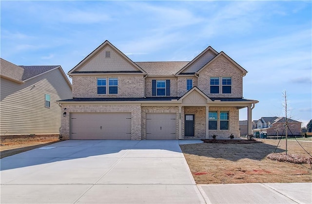 view of front facade featuring an attached garage, brick siding, and concrete driveway