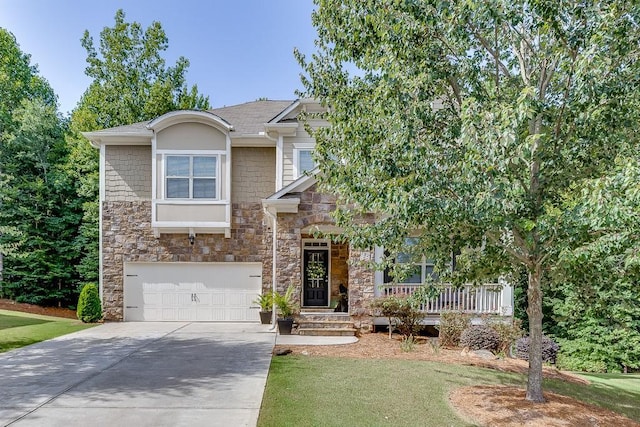 view of front of property with a front yard and a garage