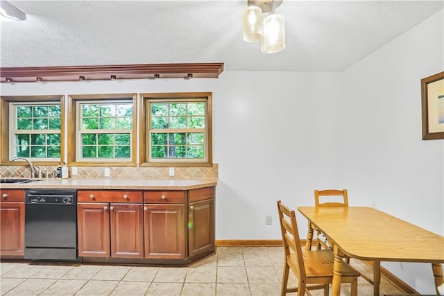 kitchen with tasteful backsplash, a healthy amount of sunlight, dishwasher, and baseboards