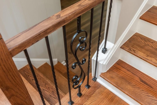 stairway featuring hardwood / wood-style flooring