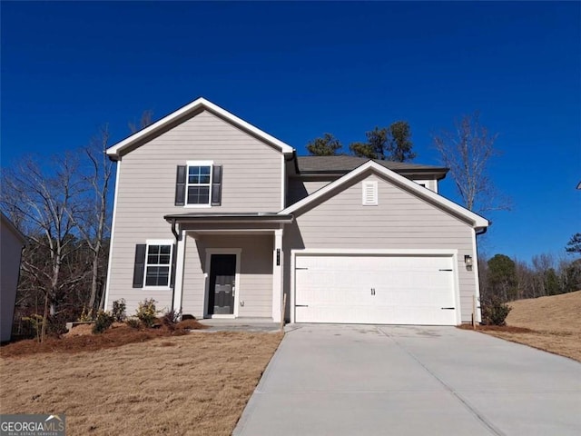 traditional home with concrete driveway and an attached garage