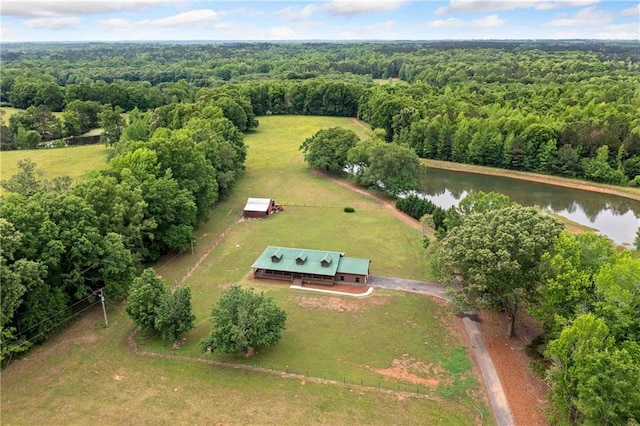 drone / aerial view with a water view and a wooded view